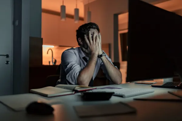 man experiencing work related stress may consider changing jobs